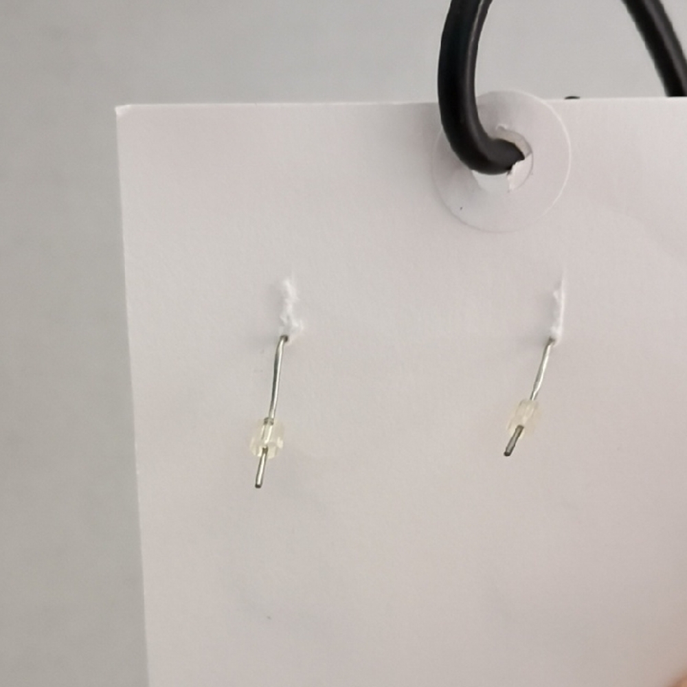 Elegant‎ Silver Colored Twisted Hoop Earrings - Picture 2 of 3